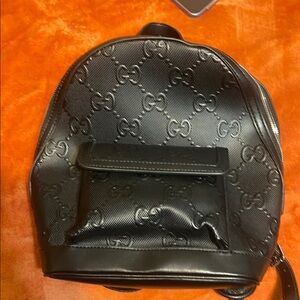 Embossed black small/medium backpack